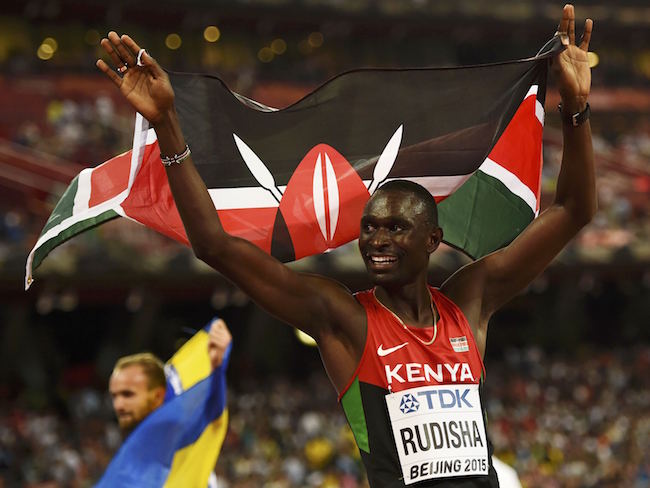 David Lekuta Rudisha of Kenya celebrates with his national flag after winning the men's 800 metres final during the 15th IAAF World Championships at the National Stadium in Beijing, China August 25, 2015. REUTERS/Dylan Martinez