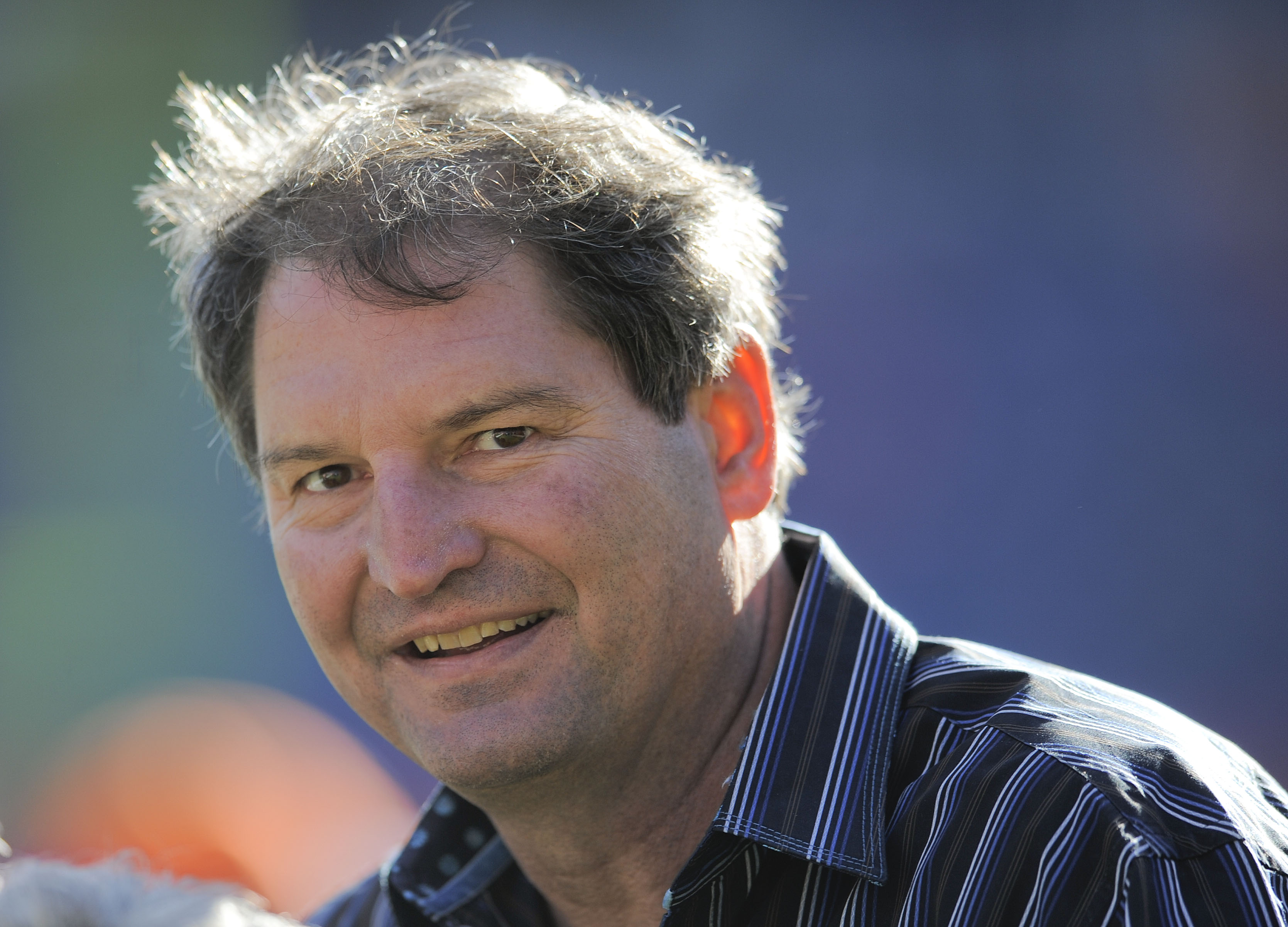 Former Cleveland Browns quarterback Bernie Kosar is pictured on the sideline before of an NFL football game between the Denver Broncos and the Cleveland Browns, Sunday, Dec. 23, 2012, in Denver. (AP Photo/Jack Dempsey)