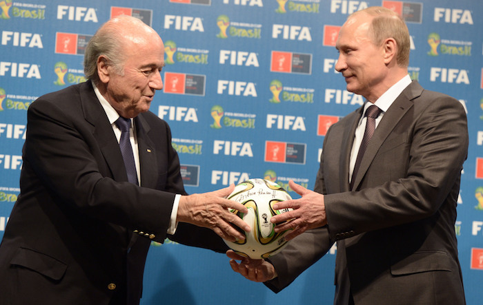 ITAR-TASS: RIO DE JANEIRO, BRAZIL. JULY 13, 2014. FIFA President Joseph Blatter (L) and Russian President Vladimir Putin pose for a photo during an official ceremony of the symbolic handover of the FIFA World Cup from Brazil to Russia. (Photo ITAR-TASS / Alexei Nikolsky)